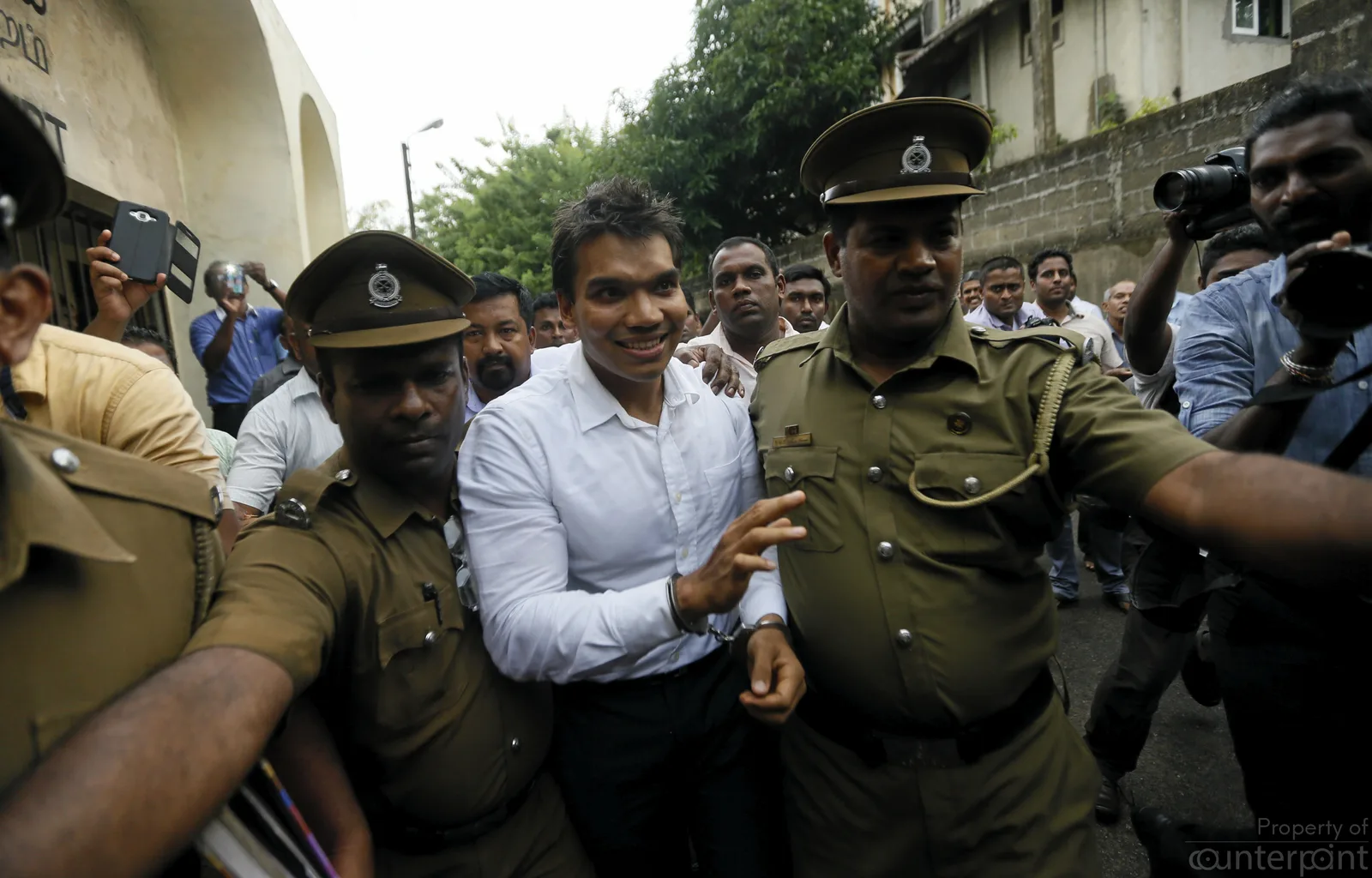 Parliamentarian Namal Rajapaksa has a couple of cases against him. Picture shows Rajapaksa being escorted by the Police after his arrest on charges of money laundering.