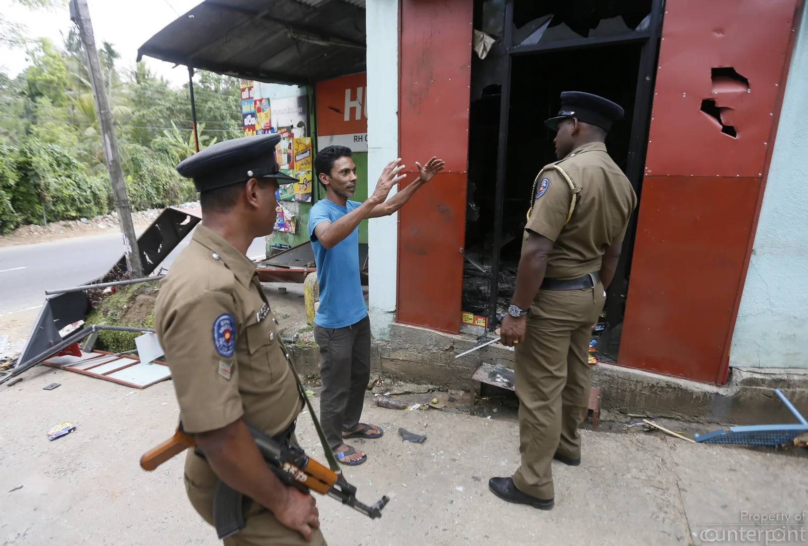 A man gives his testimony to the police following the riots in Digana, Kandy. 